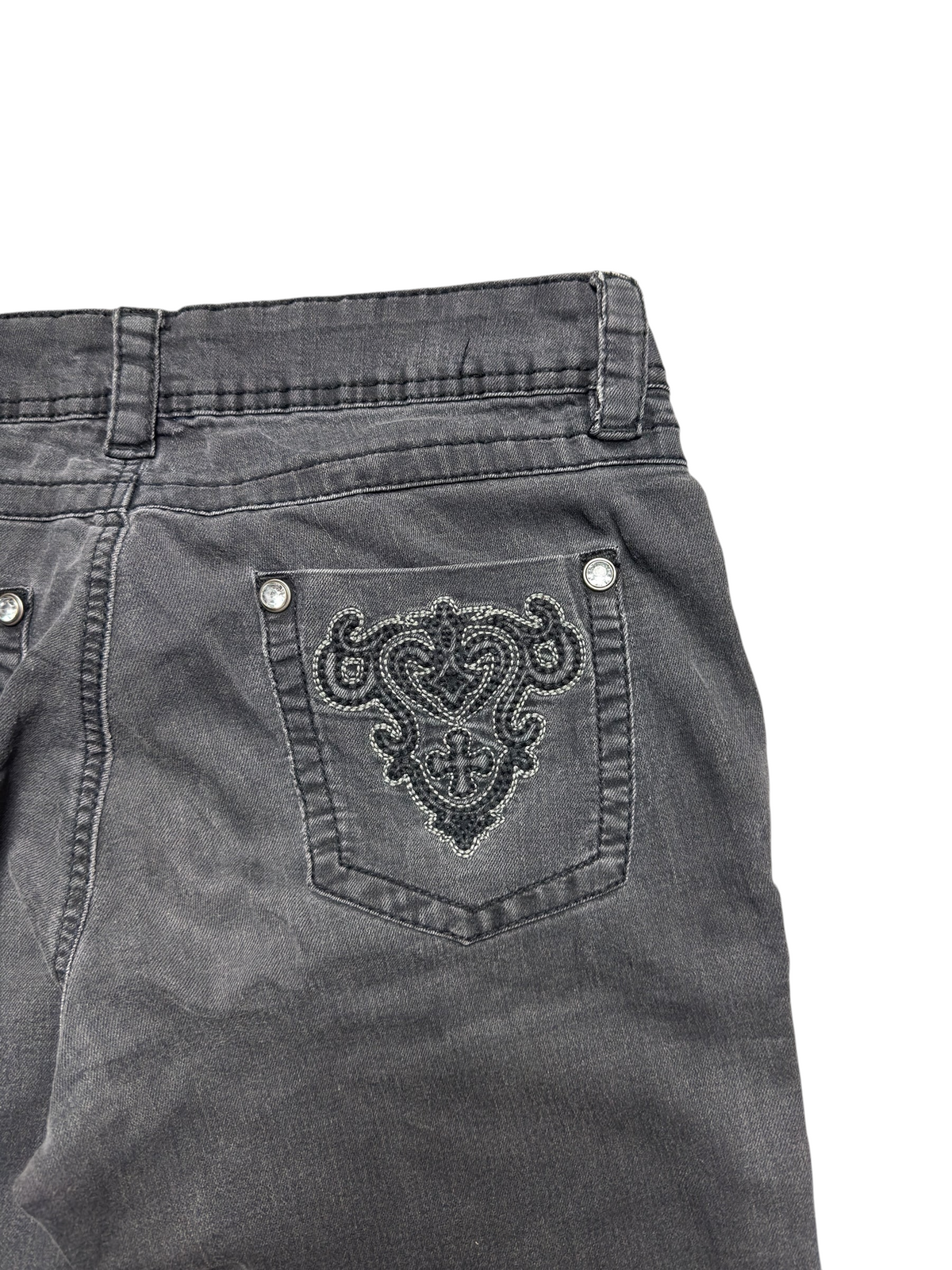 NinetyThree charcoal grey denim jeans featuring intricate back pocket embroidery and silver stud embellishments.