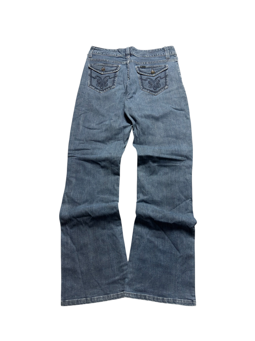 NinetyThree Lee Slender Secret medium blue denim jeans with embroidered back button-flap pockets on grey carpet